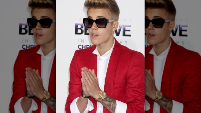 Justin Bieber making prayer hands