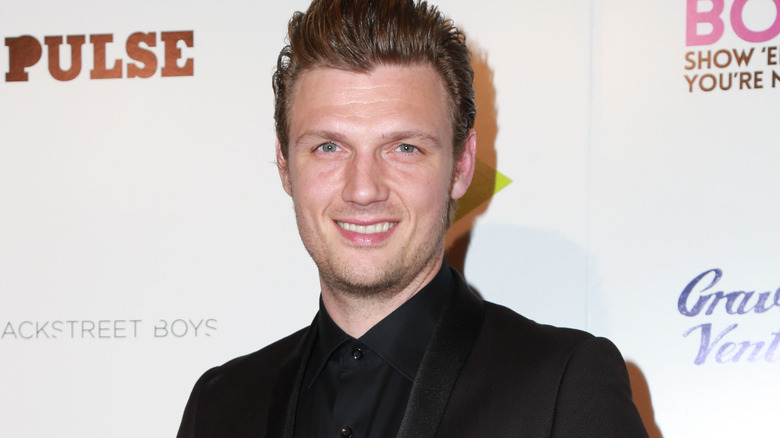 Nick Carter smiling at event