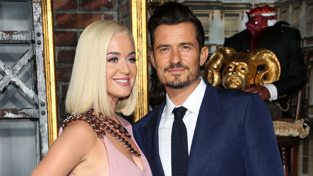 Katy Perry and Orlando Bloom posing at the premiere of Carnival Row