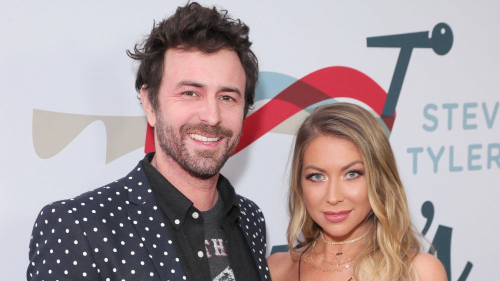 Beau Clark and Stassi Schroeder posing at Steven Tyler's 3rd Annual Grammy Awards Viewing Party