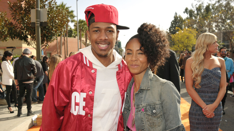 Nick Cannon and Jada Pinkett Smith pose together in 2012