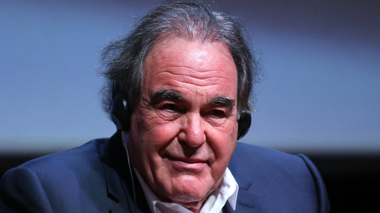 Oliver Stone sitting