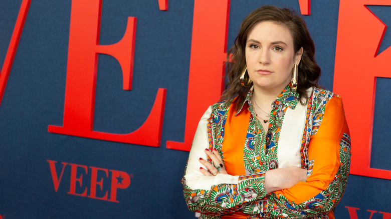 Lena Dunham crossing her arms