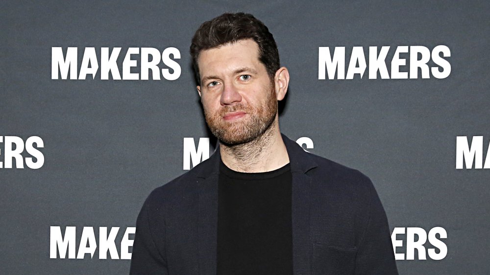 Billy Eichner in a black suit on the red carpet