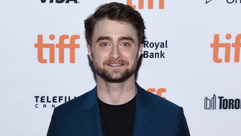 Daniel Radcliffe smiling at camera on red carpet