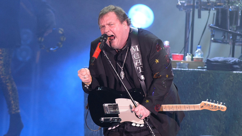 Meat Loaf singing into a microphone