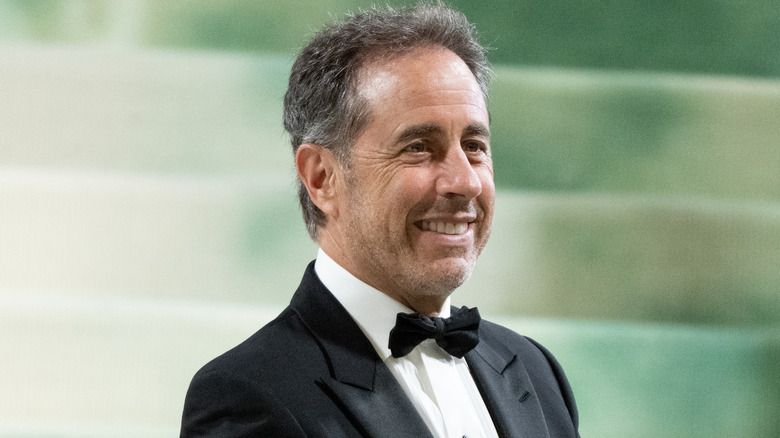 Jerry Seinfeld smiling wearing tuxedo