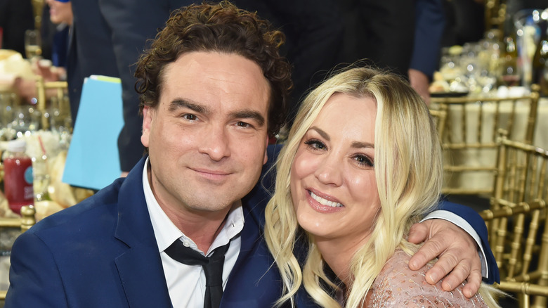 Johnny Galecki posing with his arm around Kaley Cuoco