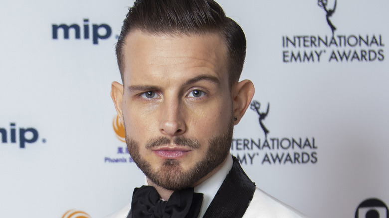 Nico Tortorella posing at an event