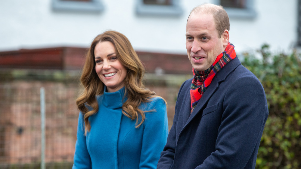 Kate Middleton and Prince William visiting a school