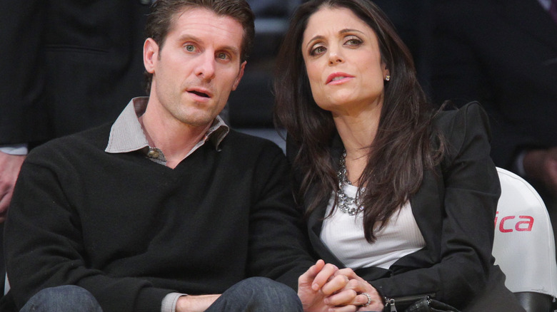 Bethenny Frankel and Jason Hoppy sit courtside