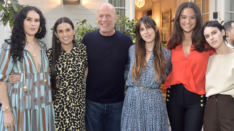 Rumer Willis, Demi Moore, Bruce Willis, Scout Willis, Emma Heming Willis, and Tallulah Willis smiling