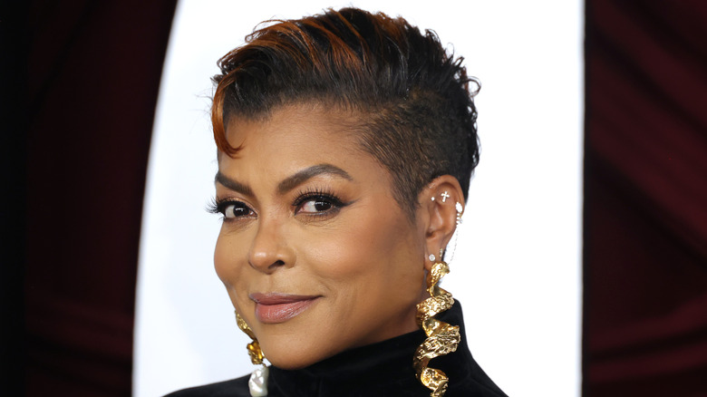 Taraji P Henson wearing her natural hair and large dangling earrings