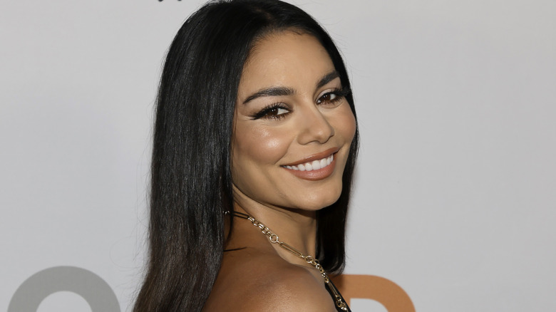 Vanessa Hudgens smiling in black dress