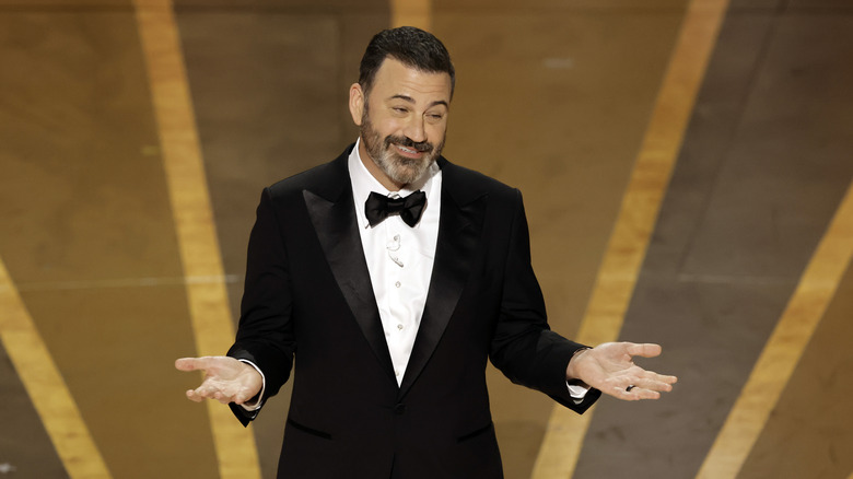 Jimmy Kimmel speaking onstage at the 2023 Oscars