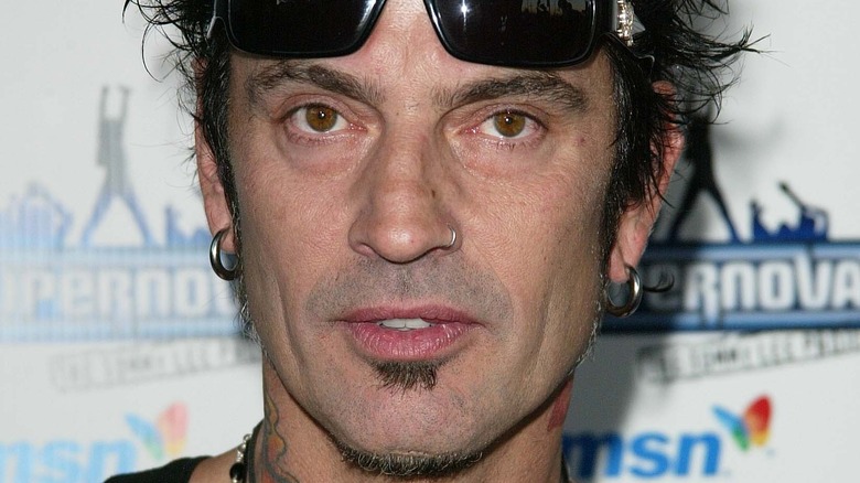 Tommy Lee with sunglasses on forehead