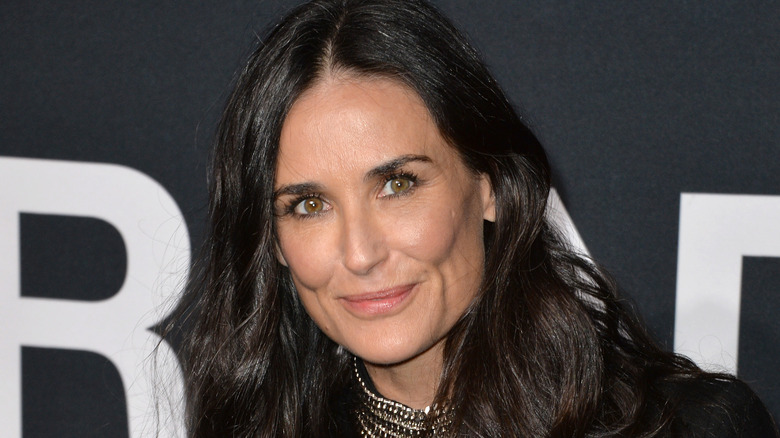 Demi Moore wearing black and smiling