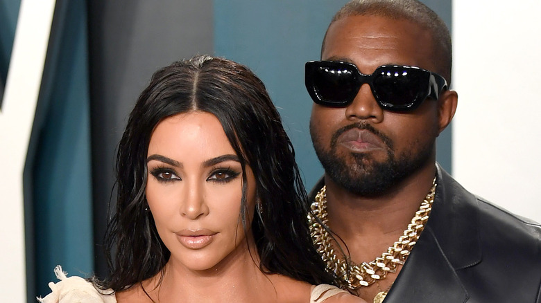 Kim Kardashian & Ye wearing shades