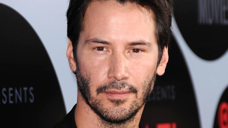 Keanu Reeves poses