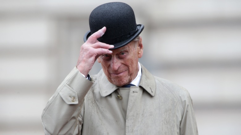 Prince Phillip tipping hat