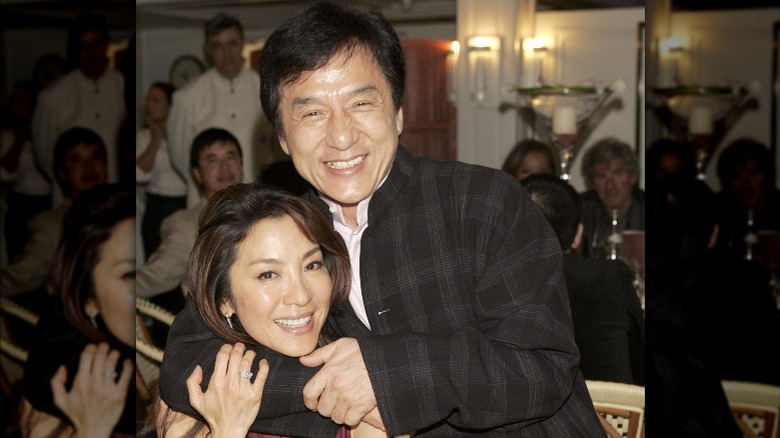 Jackie Chan with arm around Michelle Yeoh's neck