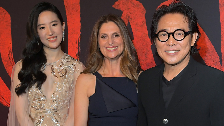 Yifei Liu, Niki Caro, Jet Li posing