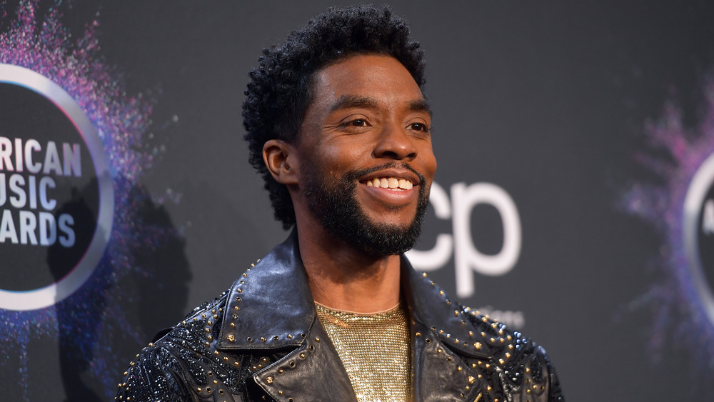 Chadwick Boseman smiling at the AMAs