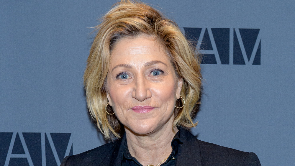 Edie Falco with a small smile