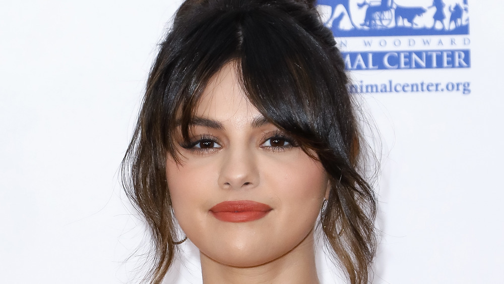 Selena Gomez with a neutral expression