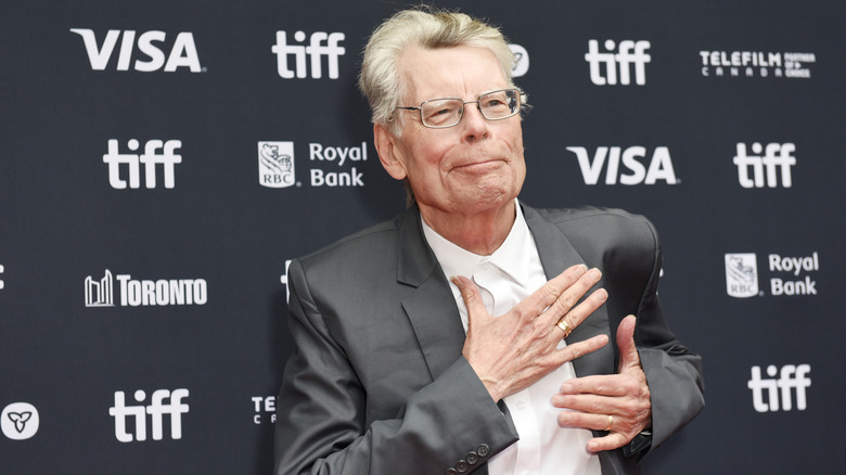 Stephen King with hand on chest