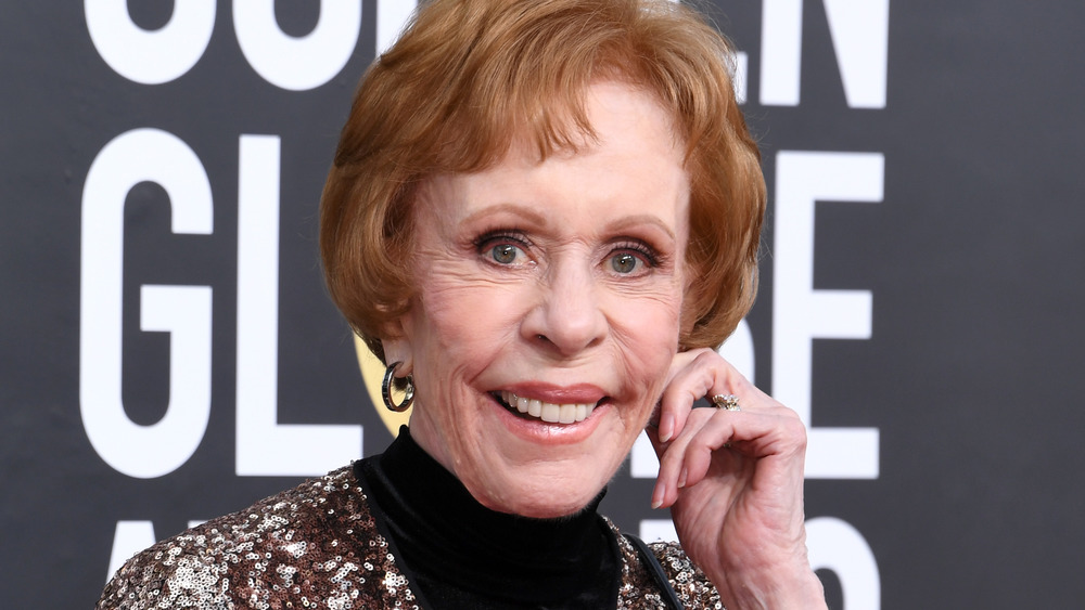 Carol Burnett tugging on her ear