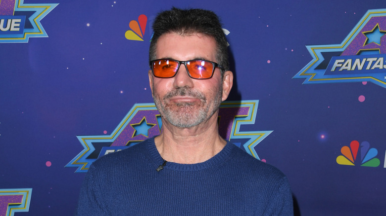 Simon Cowell orange glasses