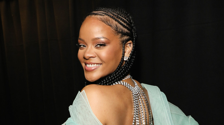 Rihanna smiling over shoulder