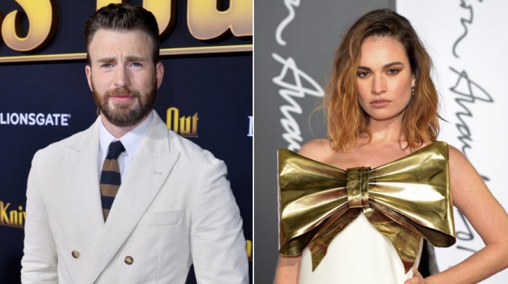 Chris Evans in a white suit and Lily James with big gold bow on her dress