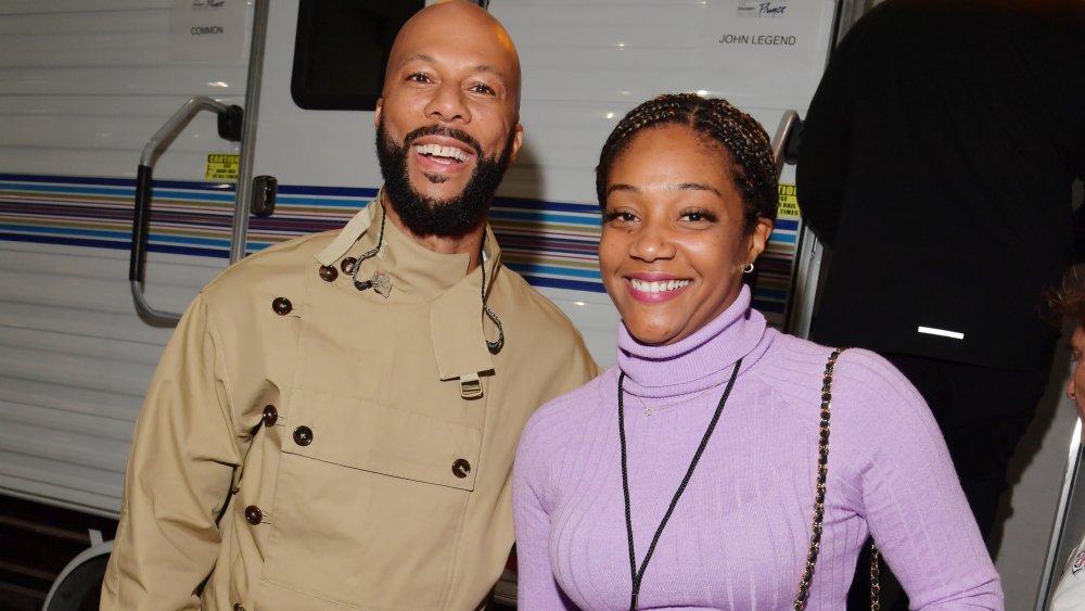 Common and Tiffany Haddish smiling together