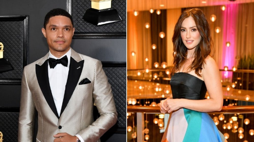 Trevor Noah in a silver suit and Minka Kelly with a blue skirt