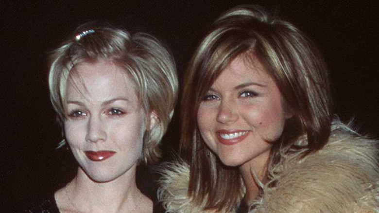 Jennie Garth and Tiffani Thiessen taking a photo