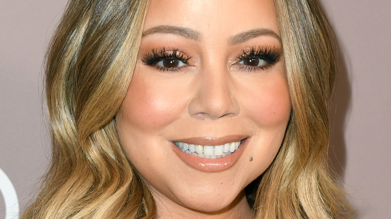 Mariah Carey smiling at event