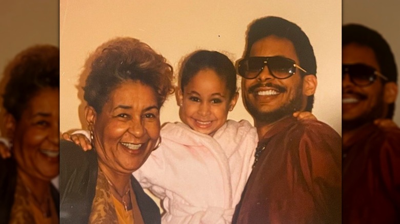 Raven Symoné poses with her mother Lydia Gauldenand father Christopher Pearman