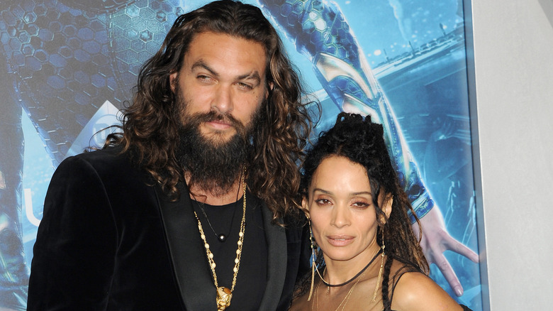 Jason Momoa and Lisa Bonet posing at an event