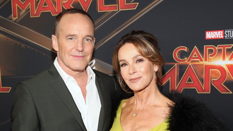 Clark Gregg and Jennifer Grey posing at a movie premiere 