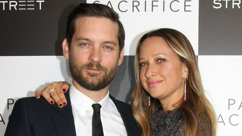 Tobey Maguire and Jennifer Meyer posing at an event