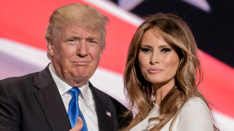 Donald Trump squinting, Melania Trump smiling