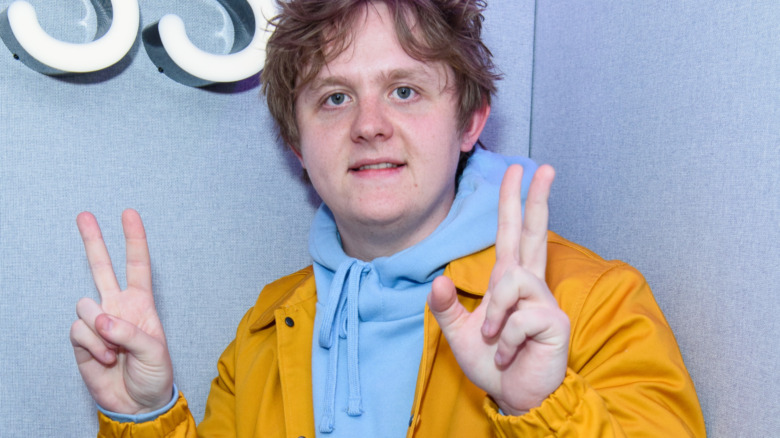 Lewis Capaldi peace signs