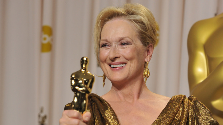 Meryl Streep holding her Oscar win