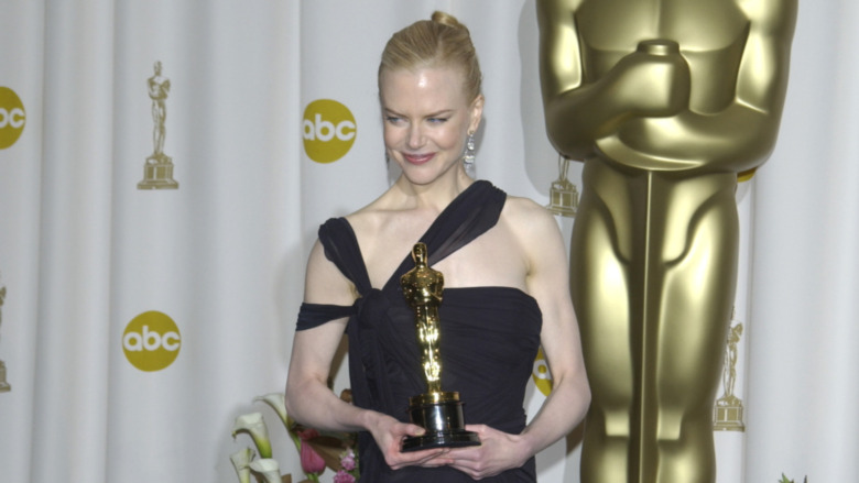 Nicole Kidman holding her Oscar award