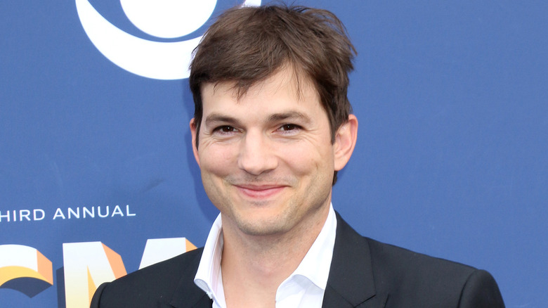 Ashton Kutcher smirking