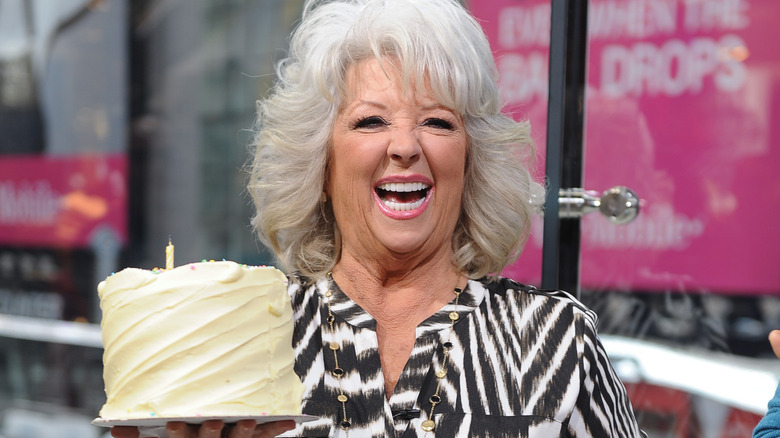 Paula Deen holding cake