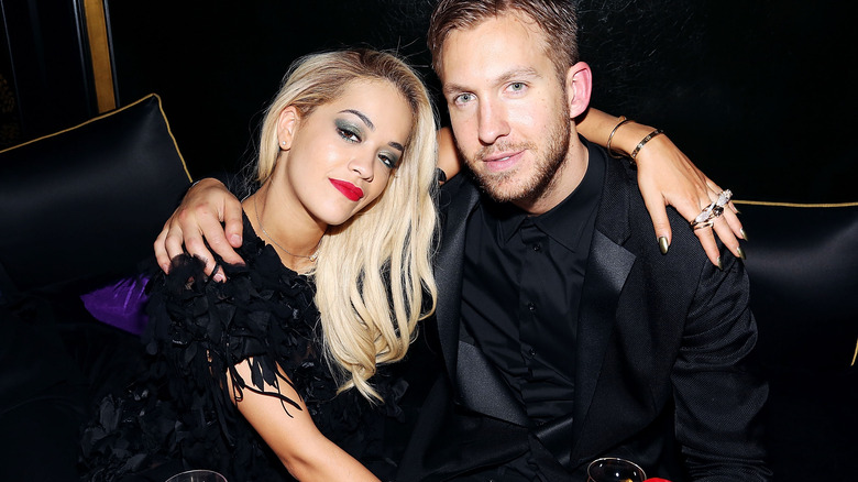 Rita Ora posing with Calvin Harris