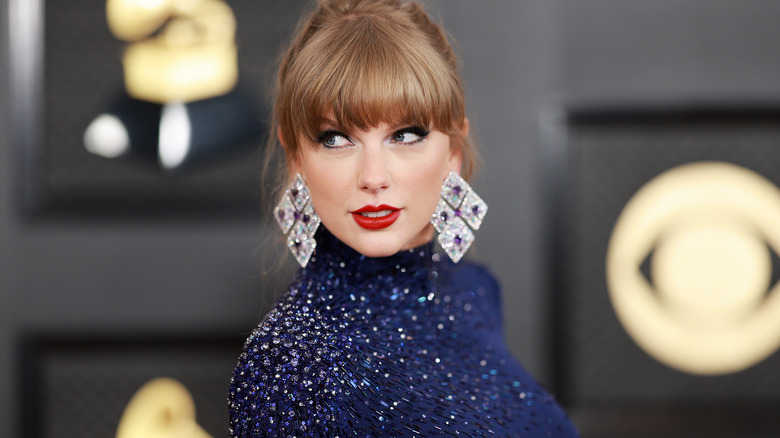 Taylor Swift posing in huge diamond earrings